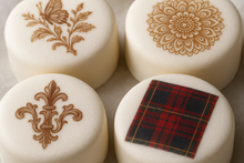 Load image into Gallery viewer, Close-up view of high-quality transferred design on white dessert showing fine detail and professional finish