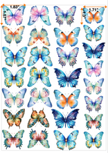 Load image into Gallery viewer, Assorted edible butterfly cake toppers featuring delicate watercolor designs in various blue tones with pink and orange accents
