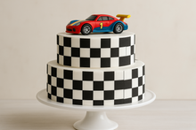 Load image into Gallery viewer, Racing themed birthday cake featuring checkered flag pattern decoration
