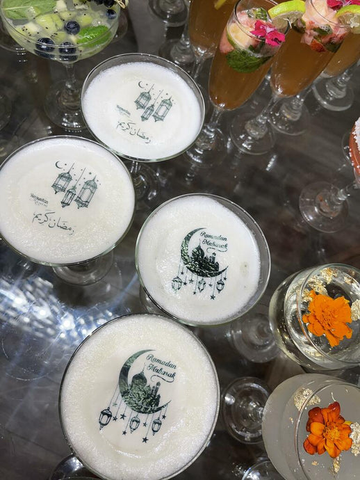 Ultra-thin edible icing toppers floating on colorful cocktails